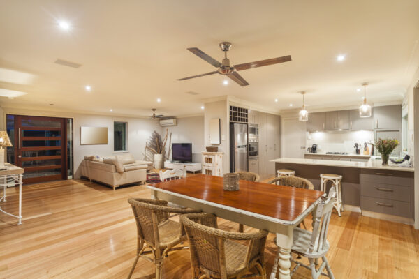 Modern ceiling fan circulating cool air in a Texas home to improve air conditioning efficiency during summer.